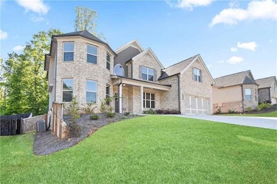 Craftsman-style home with concrete driveway, a fro