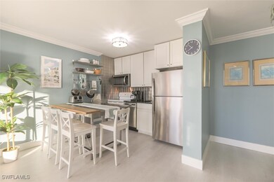 Kitchen featuring decorative backsplash, stainless