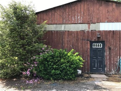 The large pole building on the property makes a gr