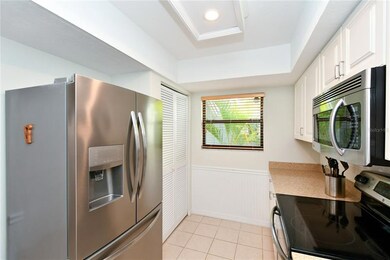 Stainless steel appliances. Pantry in the rear by the window.