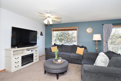 The large windows fill the room with natural sunshine, creating a warm and welcoming atmosphere.