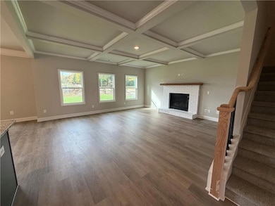 Unfurnished living room featuring ornamental moldi