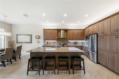 Kitchen featuring stainless steel fridge, wall chi