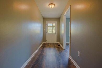 Entryway featuring dark hardwood / wood-style floo