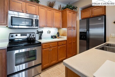 Kitchen features solid surface counter tops, stain