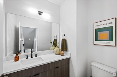 Powder Bathrooms featuring Custom Vanity and Modern Light Fixtures