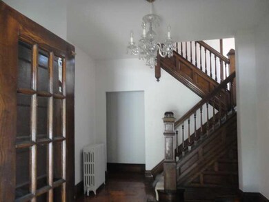 Entry/Foyer. The front foyer has French doors open