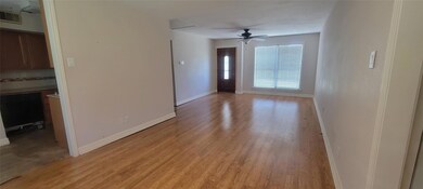 Spare room with ceiling fan and light hardwood / w