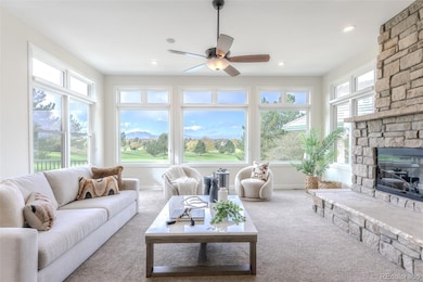 Inside, a voluminous great room unfolds—wrapped in glass that blurs the distinction between architecture and environment.