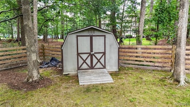 View of shed featuring a fenced backyard