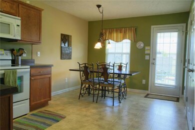 This eat in kitchen has plenty of space!  Huge pantry and door to the covered patio make this a very functional area.  