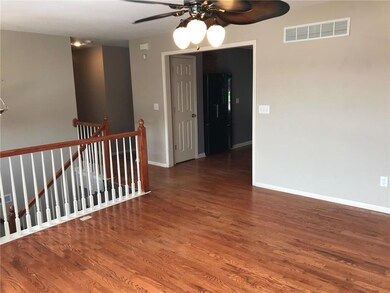 Living room looking into kitchen entrance and hall