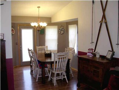 Wood laminate flooring in Dining Room w/ Entry to 