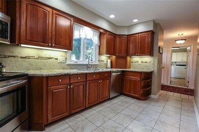 Large updated kitchen has Granite counters & wonde