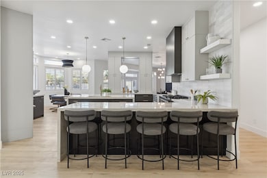 Kitchen featuring light countertops, tasteful back