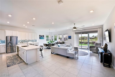 Kitchen featuring light tile patterned flooring, a