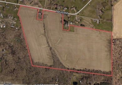 Aerial map of property and surrounding area featuring property parcel outlined