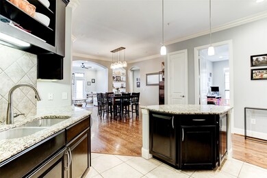 The central island is accented with pendant lighti