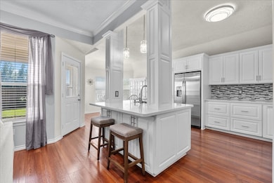 Thoughtfully designed island with outlets for easy charging and added functionality.