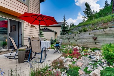 Patio off kitchen backing to national forest.