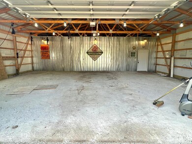 The pole shed is divided into two sections. The cold storage is 32x40 with a gravel floor.