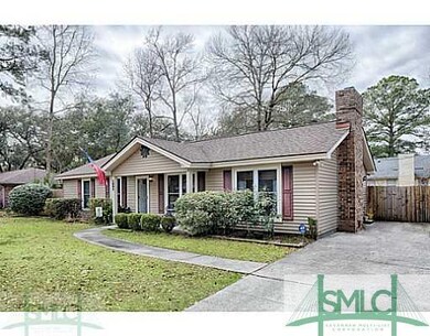 Exterior Front. Large, extended parking pad for of