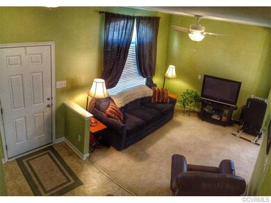 View of living room and foyer from stairs