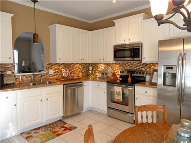 KITCHEN: Great size with breakfast area, stainless steel appiances, tile backsplash, upgraded lighting 