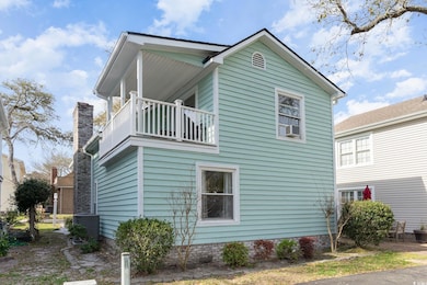 View of home's exterior with a balcony and cooling unit