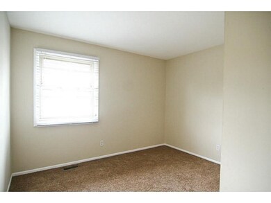 Bedroom 2. Bedroom 2 has custom shelving in closets.