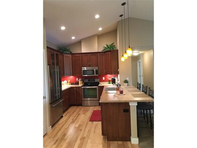 Kitchen with breakfast bar, upgraded cherry cabine