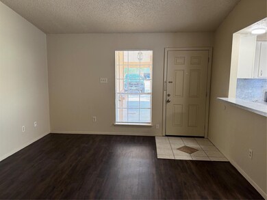 Entrance foyer featuring wood finished floors, a 