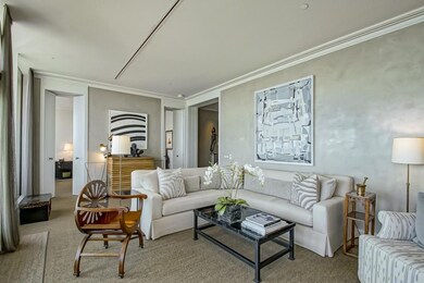 Living room w/ entrance to Primary bedroom