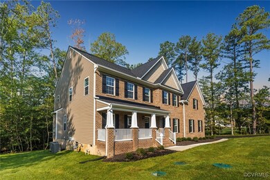View of front of home featuring cooling unit, cove
