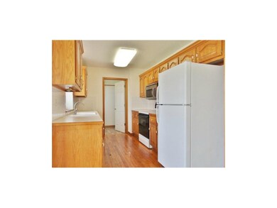 The kitchen offers gorgeous wood flooring, plenty 