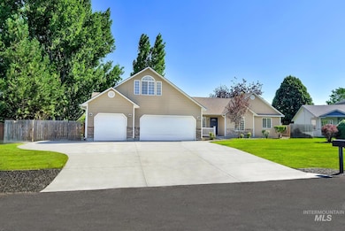 View of front of home with stone siding and concrete driveway