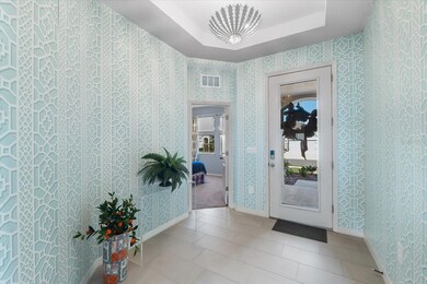 Foyer with custom wallpaper.
