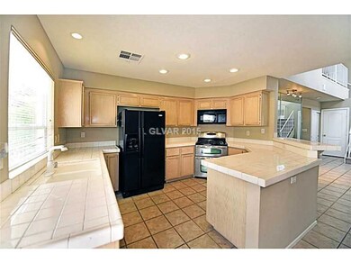 Property Photo. Light & airy kitchen overlooking d