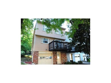 Entry from the parking lot shows the garage and th
