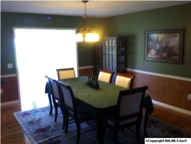 Dining room with hardwood flooring