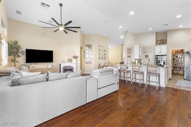 Living room featuring visible vents, hardwood / wo