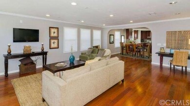 Living room that opens to the dining area and the 
