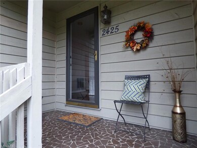 Pretty covered porch front entry.
