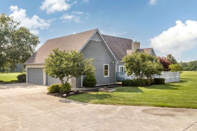 4 car attached garage, concrete driveway