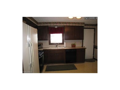 Kitchen has tile backsplash.