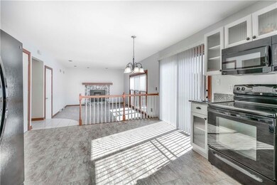Eat-in kitchen opens to the cozy family room featu