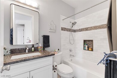 Full bath featuring shower / bath combo, vanity, a