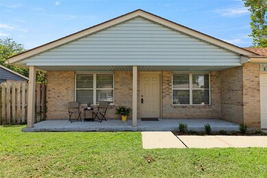 View of front of property with covered porch and a