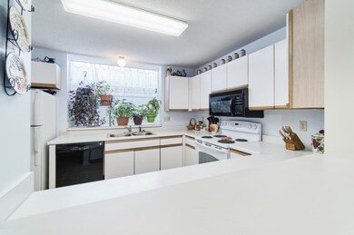 Kitchen opens to dining area