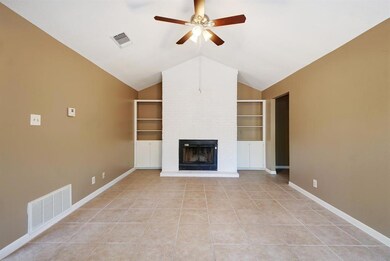 Unfurnished living room with built in shelves, ce